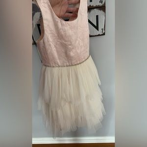 Gorgeous pale pink and cream colored special occasions dress in girls size 8 .